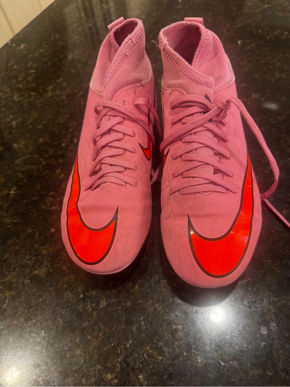 Nike Women's Pink High-Top Soccer Cleats with Orange Swoosh